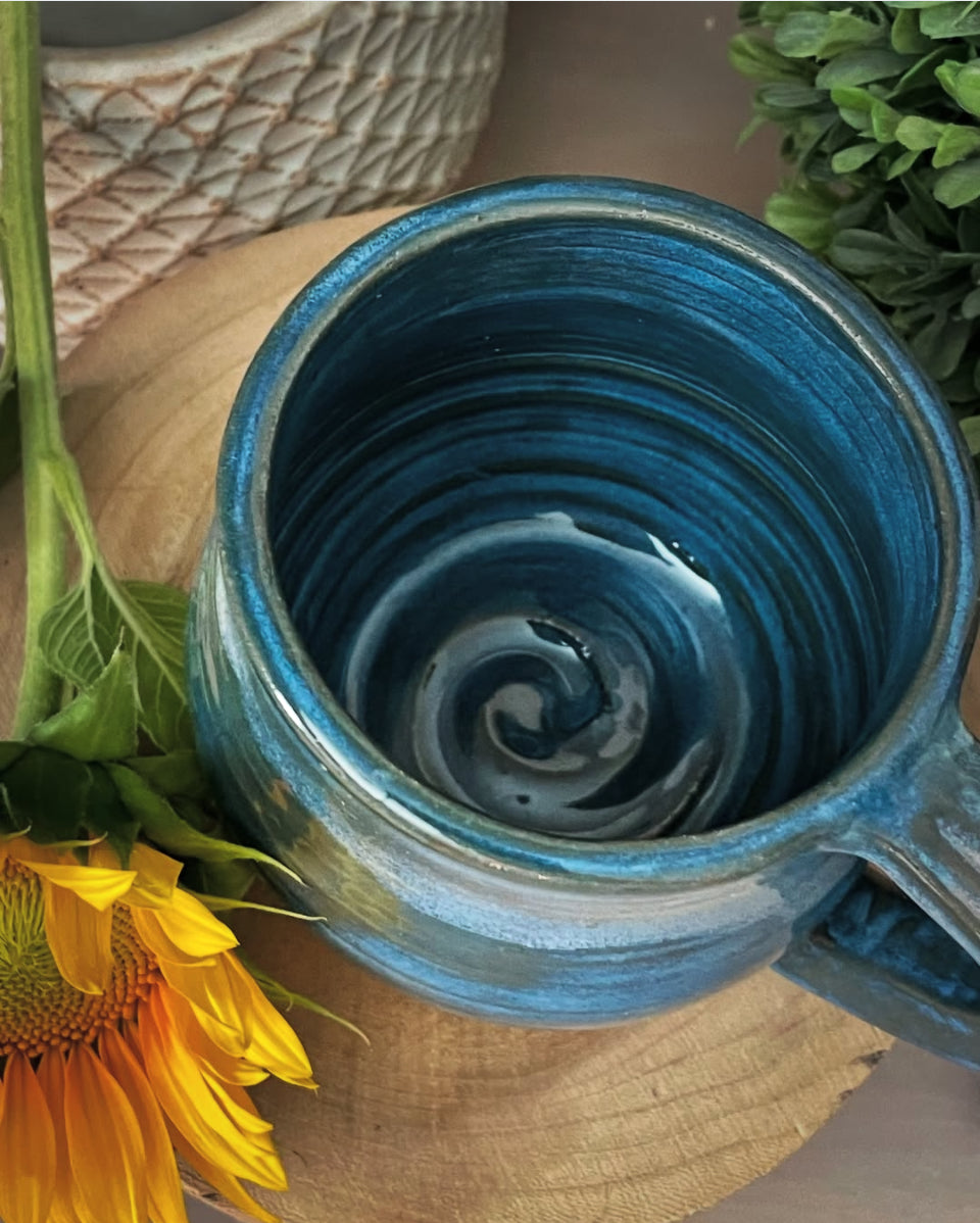 Close-up of textured ceramic swirl base