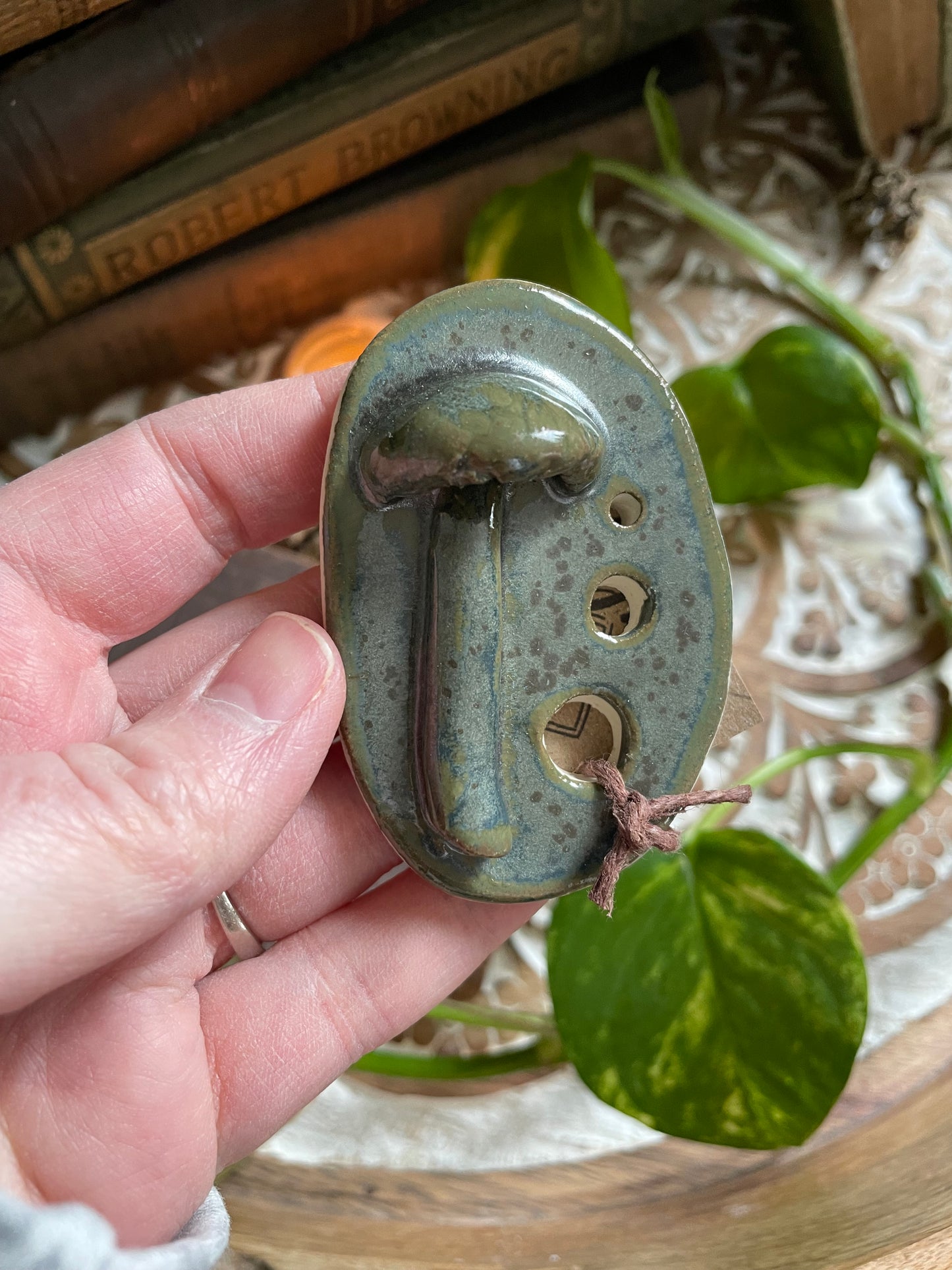 Functional and decorative stoneware herb stripper with nature-inspired design