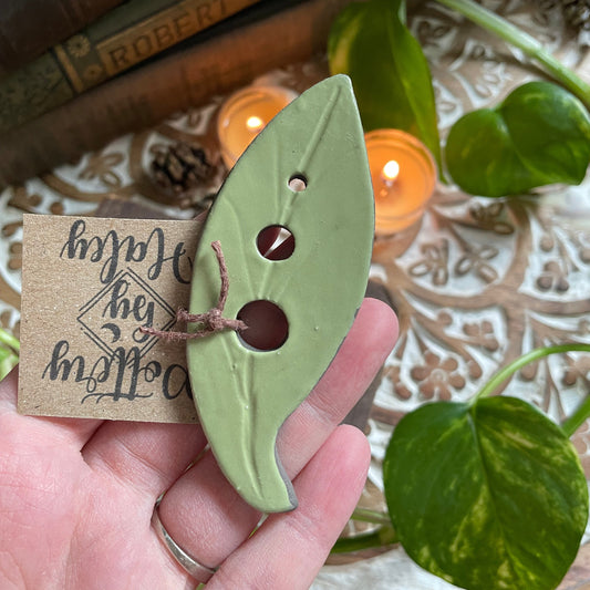 Green glazed ceramic herb stripper for removing leaves from stems