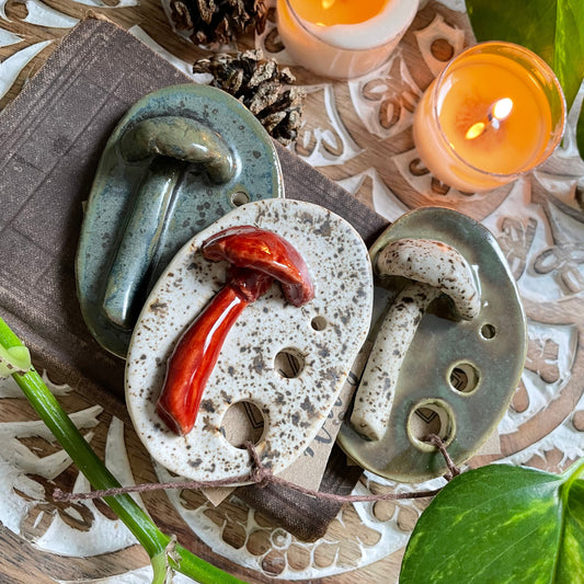 Handmade stoneware herb stripper with hand-built mushroom accents and green glaze