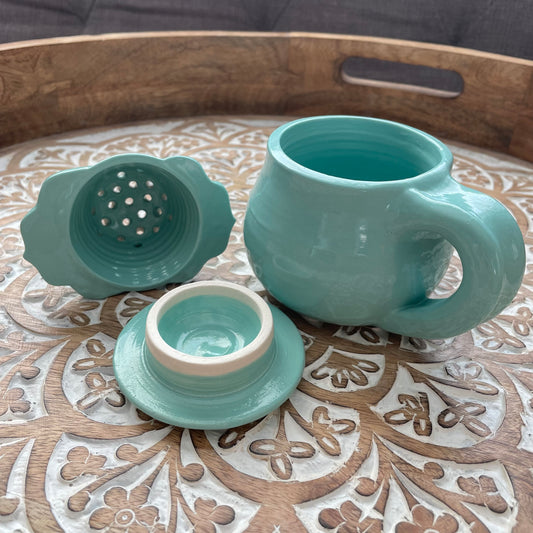 teacup strainer tea drinker cup with decorative leaf strainer, handmade ceramic stoneware aqua